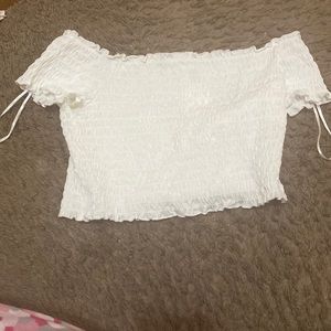 A white off the shoulder crop top very stretchy never worn with tag